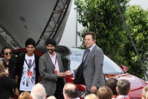Elon Musk handing the keys
